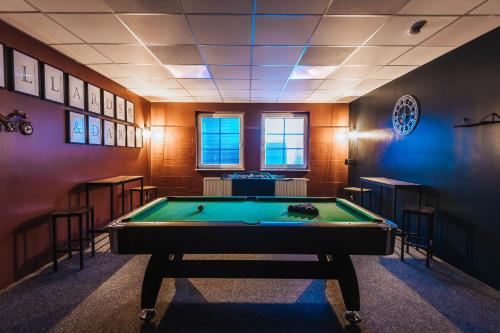 a billiard room with a pool table in it at XXL Ferienhaus Goldberger See - Sauna - 16 Personen in Goldberg