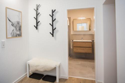 a bathroom with a sink and a mirror at Appartement - Weltringpark 2-T Winterberg in Winterberg