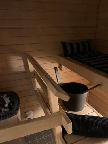 a inside of a sauna with a bucket and a bed at Holiday Home Turku City in Turku