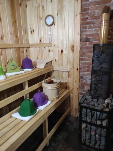 a room with wooden walls and shelves with hats on them at Casa din Plai - Bucovina in Moldova Suliţa