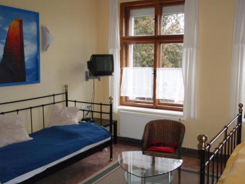 Postel nebo postele na pokoji v ubytování Pension Stará Škola