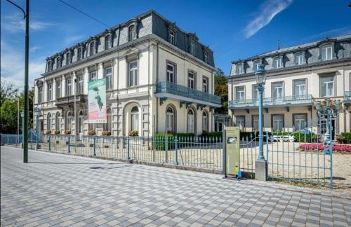 a building with a fence in front of it at Résidence Gabrielle centre de Spa in Spa