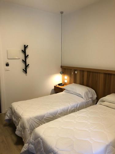 Un ou plusieurs lits dans un hébergement de l'établissement Hotel Oliva