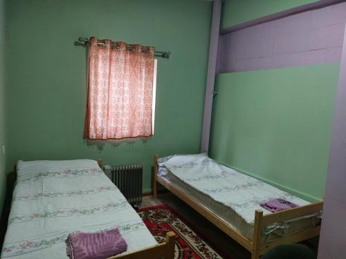 A bed or beds in a room at KONOK Center OSH