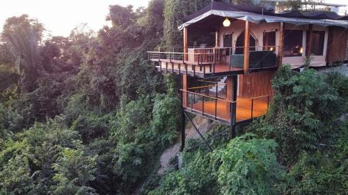 a tree house in the middle of a mountain at HBG Glamping community Yoga & Wellness space in Santa Teresa Beach
