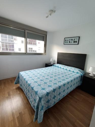 Un pat sau paturi într-o cameră la Apartamento. Parque del Vino Fino. El Puerto de Santa María