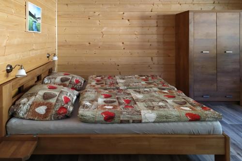 Llit o llits en una habitació de Penzion Rankl-Sepp