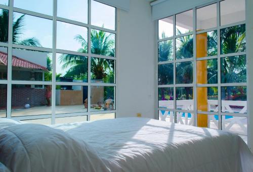 Postel nebo postele na pokoji v ubytování Hotel - Granja de Animales San Basilio de Palenque