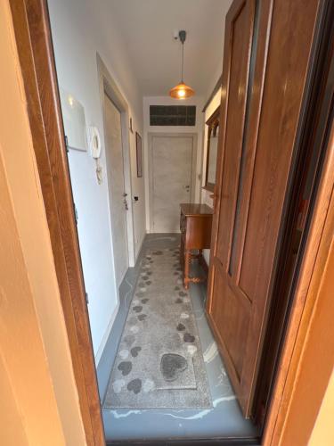 a hallway with a door leading into a room at Macloud pub B&B in Sarnico