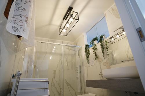 a bathroom with a shower and a toilet and a sink at Giata home in Naples