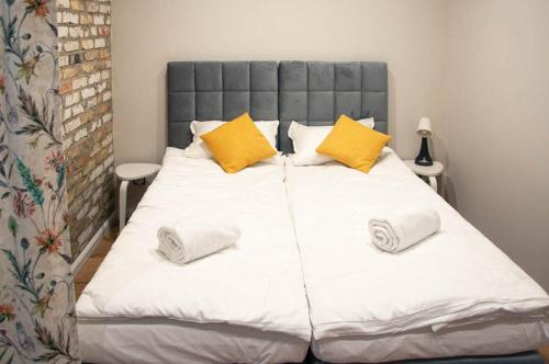 Postel nebo postele na pokoji v ubytování Topaz Apartamenty