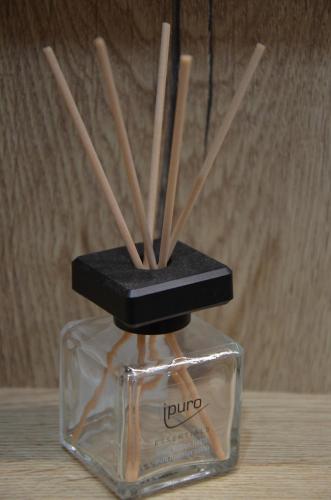 a block of wooden sticks in a glass container at Visit sauna Klinovec in Loučná pod Klínovcem