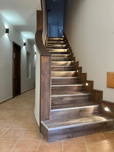 a stairway with wooden steps in a building at Nussbaum Panzió in Keszthely