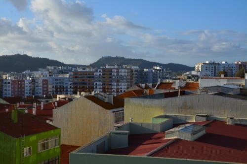 a view of a city with buildings at M&H Loft - Apartamento T2 em Setúbal in Setúbal