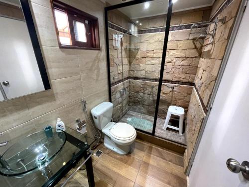 a bathroom with a shower and a toilet and a sink at Angeles in La Paloma
