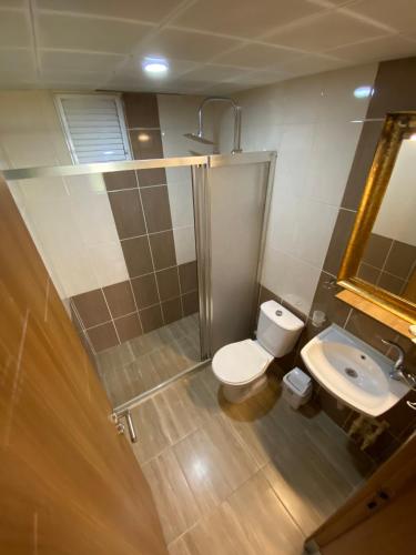 Ванна кімната в Nova Suite Residence