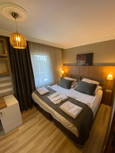Кровать или кровати в номере Nova Suite Residence