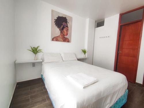 Кровать или кровати в номере Hospedaje El Chino