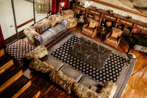 an overhead view of a living room with couches at Flavia Hotel in Oaxaca City