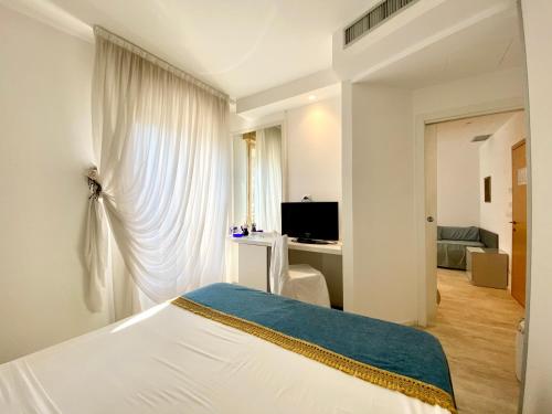 Μια τηλεόραση ή/και κέντρο ψυχαγωγίας στο Hotel Cavallino Bianco