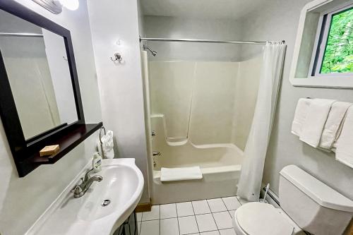a bathroom with a shower and a toilet and a sink at Summertime in Bar Harbor