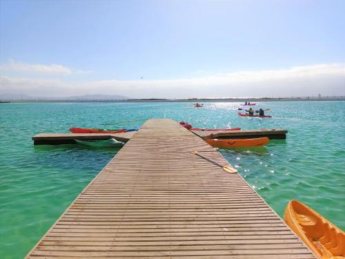 a dock with several boats on a large body of water at Departamentos Laguna del Mar in La Serena