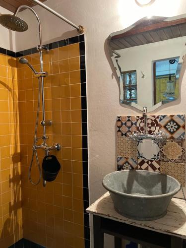a bathroom with a sink and a shower at Loft - Casinha à Porta in Arouca