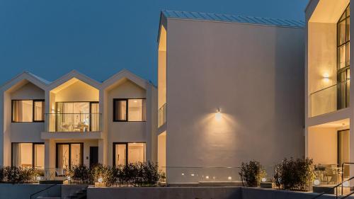 a rendering of a large white building at Albescent Poolvilla in Gyeongju