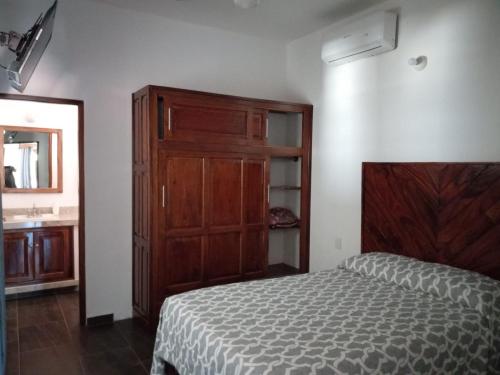 DownTown Rooms San Pancho Mexicoにあるベッド