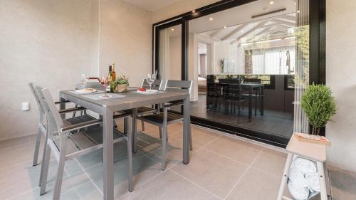 a dining room with a table and chairs at Albescent Poolvilla in Gyeongju