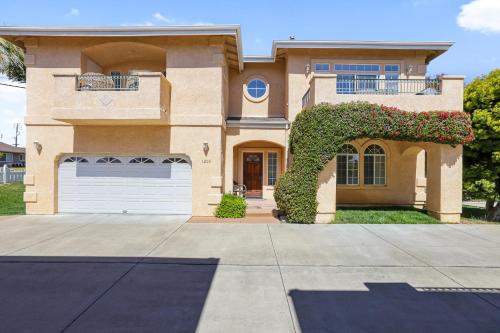 a large house with a garage at Santo Tomas Getaway - STR0153 in Grover Beach