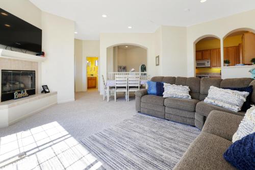a living room with a couch and a fireplace at Santo Tomas Getaway - STR0153 in Grover Beach