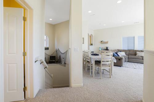a living room with a kitchen and a dining room at Santo Tomas Getaway - STR0153 in Grover Beach