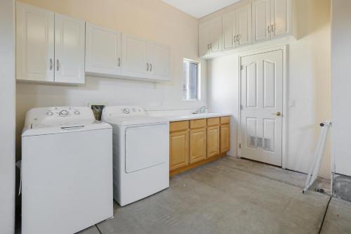 a kitchen with a washer and dryer in it at Santo Tomas Getaway - STR0153 in Grover Beach