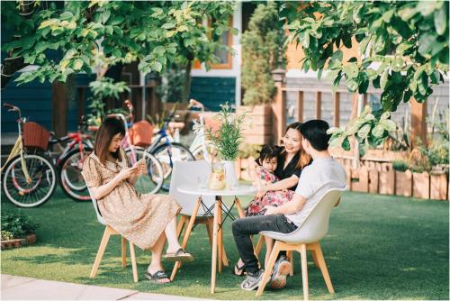 a group of people sitting around a table at Ninh Binh The View Point Home & Spa in Ninh Binh