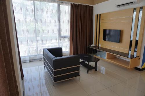 Μια τηλεόραση ή/και κέντρο ψυχαγωγίας στο Scott Service Suites