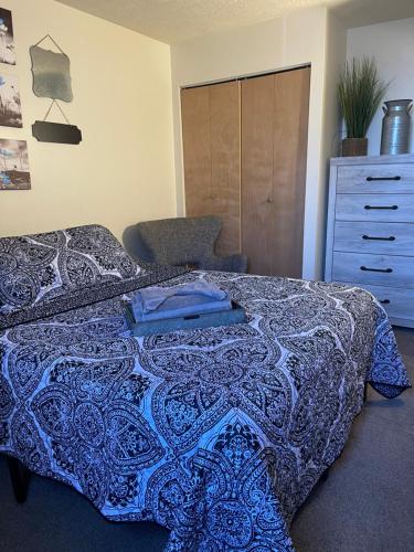 a bedroom with a blue bed with a dresser and a drawer at Have At It , University City, Smart Tv, Free Street Parking, Zip Car Site in Philadelphia