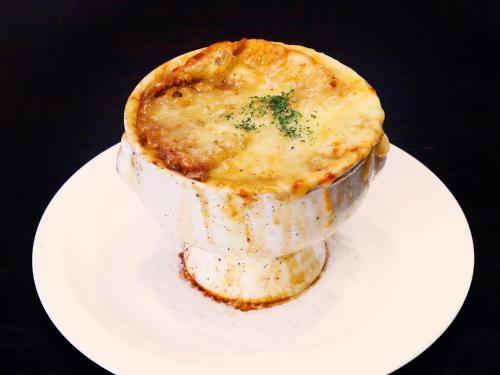 a pie on a white plate on a table at The Gate Hotel Kaminarimon by Hulic in Tokyo