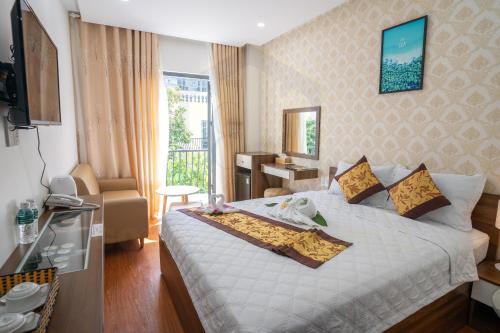Ένα ή περισσότερα κρεβάτια σε δωμάτιο στο GOLD CITY Hotel