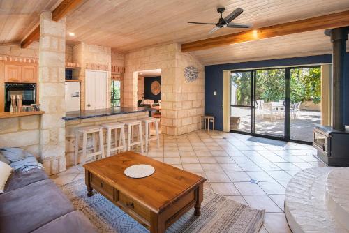 a living room with a couch and a table at Sea Glass Beach House Gnarabup in Gnarabup