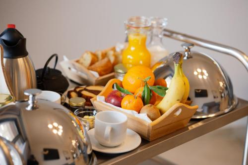 a tray of fruit on top of a table at Belvedere Luxury Apartments & Spa in Plakias