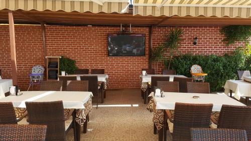 Sky Alremu Apart Hotelにあるレストランまたは飲食店