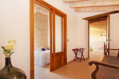 a room with a door leading to a bedroom at Villa Son Pons by Slow Villas in Llucmajor