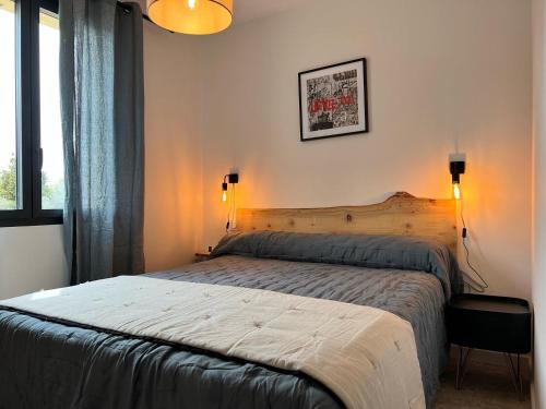 a bedroom with a large bed in a room at Mazet Brunelly in Paradou