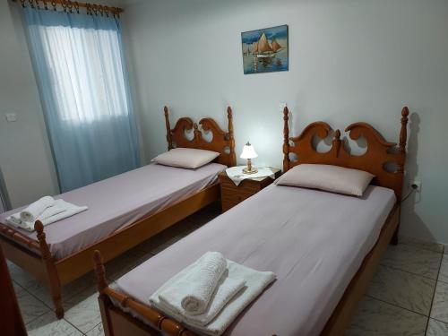 A bed or beds in a room at 85 sqm Apartments New Panorama ELECTRIC CAR ΦΩΡΤΗΣΗΣ STATION