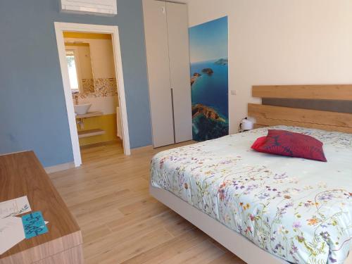 a bedroom with a bed and a table in it at Bamboo in Procida