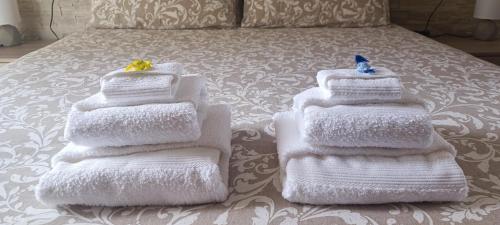 Postel nebo postele na pokoji v ubytování Attico VistaLago - Centro città Verbania