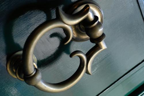 a brass door handle on a glass door at Rocco Forte Hotel De Russie in Rome