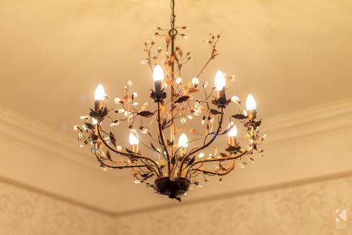 a chandelier hanging from a ceiling in a room at Herdwicks in Millom