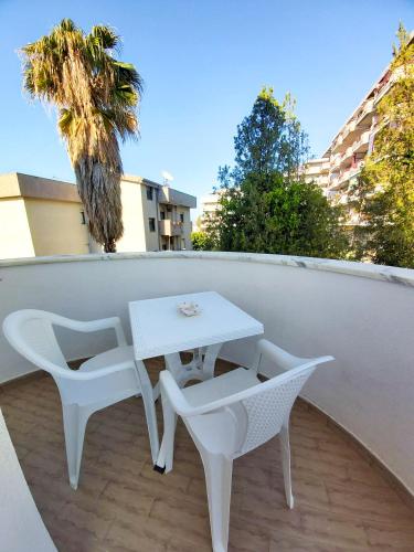 a white table and chairs on a balcony at Le Twins -Bed and Breakfast in Tropea